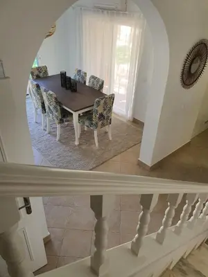 a dining room with a table and chairs at Real Village in Quarteira