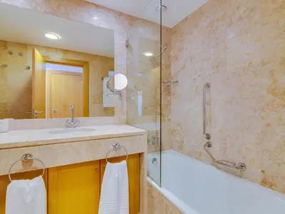 a bathroom with a sink and a shower and a tub at AL - Apartamento Vila Sol AG in Vilamoura