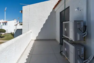 a balcony of a white building with a window at Vilamoura Marina Villa in Vilamoura