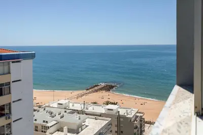 a view of a beach from a building at Quarteira SeaViews in Quarteira