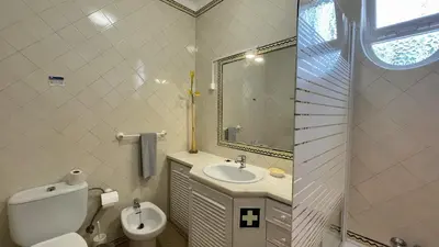 a bathroom with a toilet and a sink and a mirror at Solar by Check-in Portugal in Albufeira