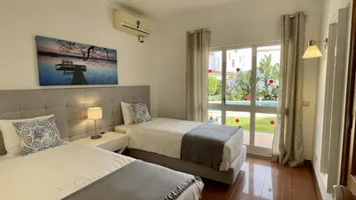 a bedroom with two beds and a window at Solar by Check-in Portugal in Albufeira