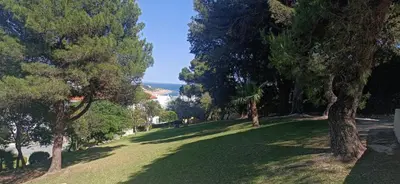 a park with trees and the ocean in the background at Sea & Oldtown View in Albufeira